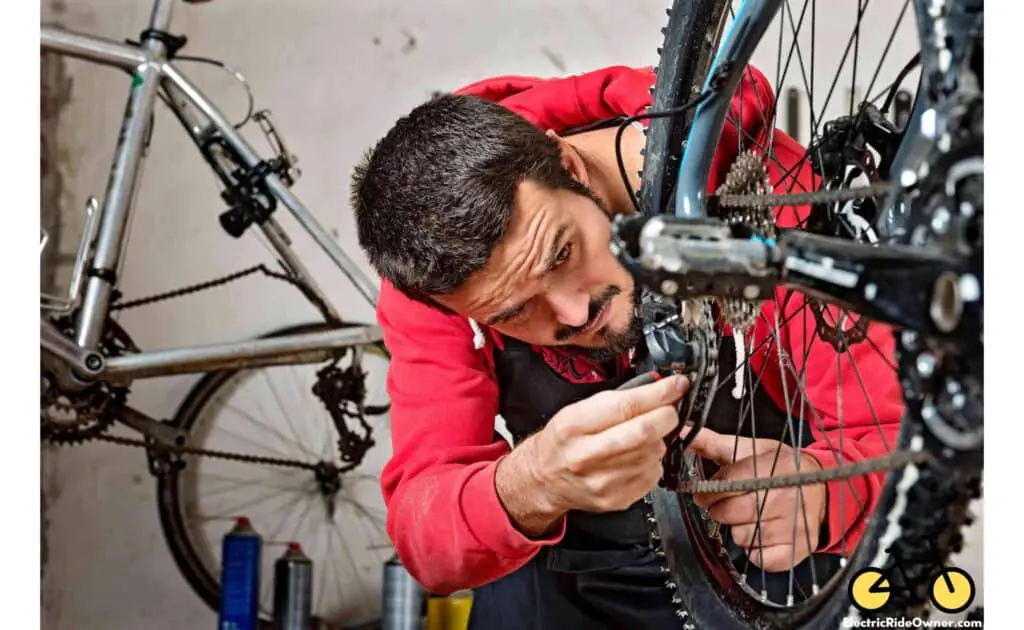 mechanic cleaning a bike