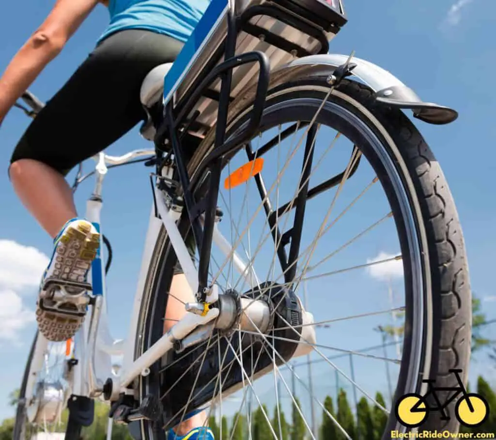 a woman riding an e-bike