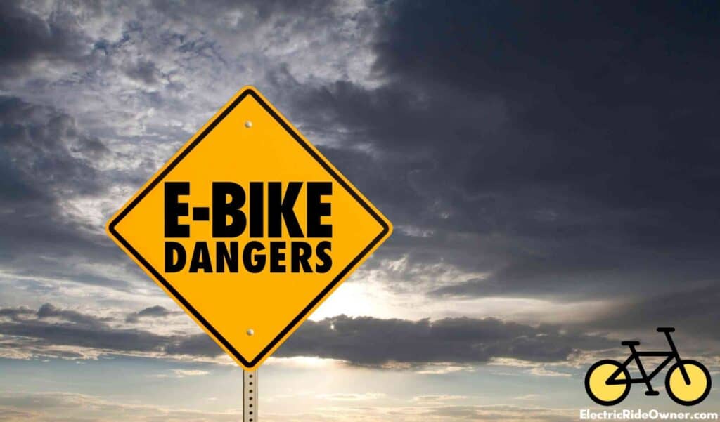 ebike dangers yellow sign with dark and cloudy sky in background