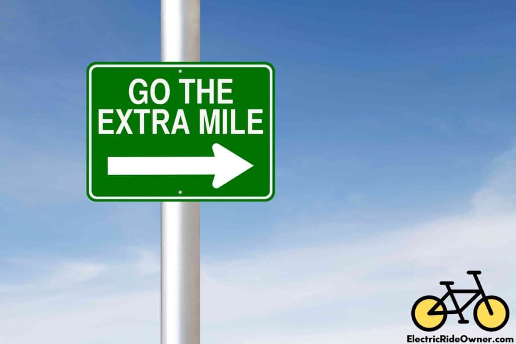 go the extra mile road sign