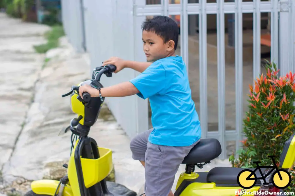 a boy riding an electric bike