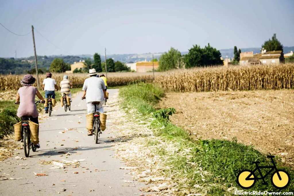 a few people riding electric bikes