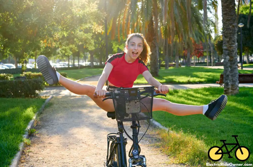 girl riding e-bike in a city park